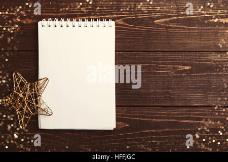 Christmas blank notebook on the brown wooden table Stock Photo