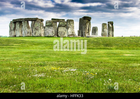 Lush green fields by prehistoric Stonehenge in Salisbury, England Stock Photo