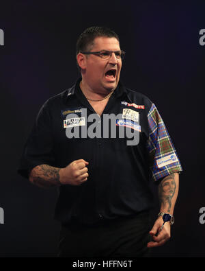 Gary Anderson celebrates during his match against Dave Chisnall during day thirteen of the William Hill World Darts Championship at Alexandra Palace, London. Stock Photo