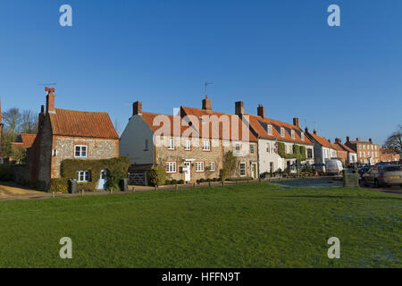 Looking across the green towards North Street at Burnham Market, Norfolk, England, United Kingdom Stock Photo