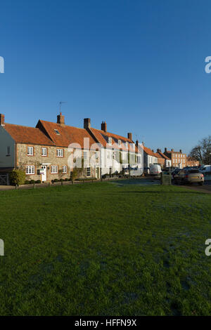 Looking across the green towards North Street at Burnham Market, Norfolk, England, United Kingdom Stock Photo