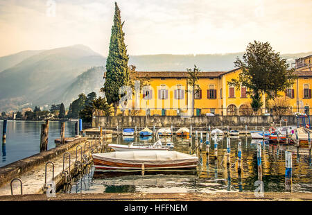 italian lakeside village iseo dock boats Stock Photo