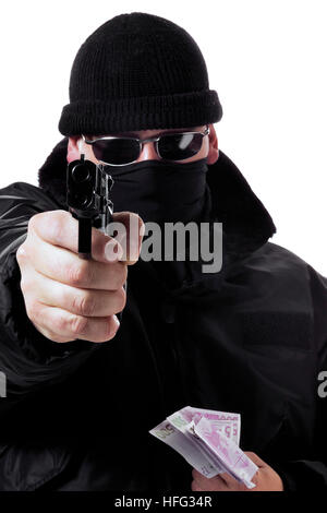 Man wearing disguise holding cash in his one hand, pointing a gun with the other Stock Photo