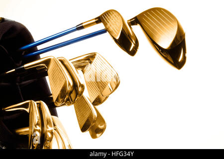 Gold golf clubs in a golf bag Stock Photo