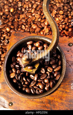 Coffee beans in an old-fashioned coffee grinder Stock Photo
