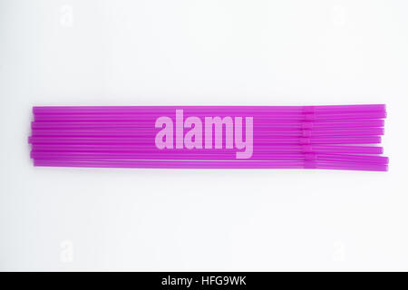 Pink drinking plastic straws on white background Stock Photo