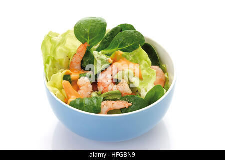 Shrimp salad in a bowl: shrimps, lamb's lettuce, head lettuce and cocktail sauce Stock Photo