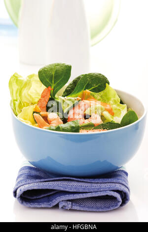 Shrimp salad in a bowl: shrimps, lamb's lettuce, head lettuce and cocktail sauce Stock Photo