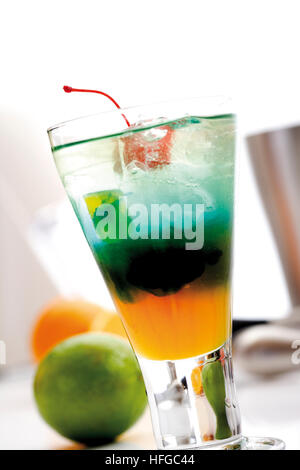 Shooter: Curacao Orange, Blue Curacao and Gin on ice, garnished with a maraschino cherry Stock Photo