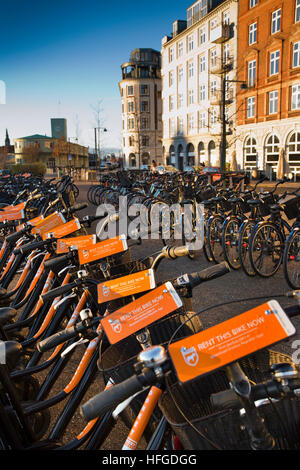 Denmark, Copenhagen, Havnegade, Donkey Republic bicycle rental bikes in early morning sunsshine Stock Photo