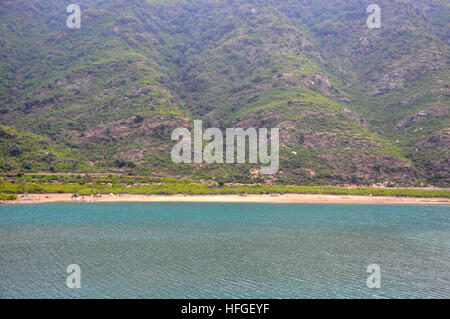 Coastal area along the mountain from up above Stock Photo