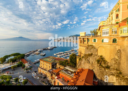 View down to the Marina Piccola and harbour in Sorrento, Campania, Southern Italy. Mount Vesuvius on the horizon. Stock Photo