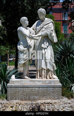 Lucius Papirius Talking with his Mother sculpture in the Villa Comunale, Naples, Campania, Italy. 17thC public garden of Ferdinand IV. 1770 copy. Stock Photo