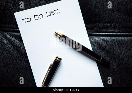pen and the words To Do List written on white paper Stock Photo