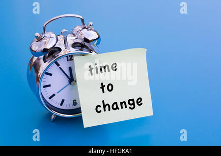 alarm clock with words on sticker Time To Change Stock Photo