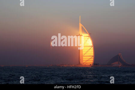 Dubai, United Arab Emirates. 30th Dec, 2016. The hotel Burj Al-Arab, literally Arabian tower, is seen during sunset in Dubai, the United Arab Emirates, Dec. 30, 2016. © Li Zhen/Xinhua/Alamy Live News Stock Photo