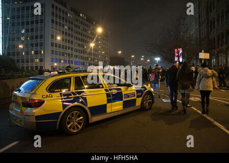 London, UK. 1st January 2017. Hundreds of revellers arrive at Waterloo for the New Years Eve fireworks celebrations with increased security road closures and Anti Terror measures put in place Credit: amer ghazzal/Alamy Live News