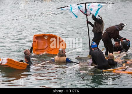 Poole, Dorset, UK. 1st Jan, 2017. Hundreds turn out to watch the New Years Day Bath Tub Race. A variety of unusual craft take to the water to race, having fun throwing eggs and flour, firing water cannons and capsizing competing craft. Vikings are sinking! © Carolyn Jenkins/Alamy Live News Stock Photo