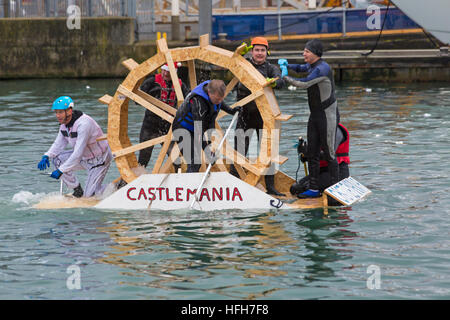 Poole, Dorset, UK. 1st Jan, 2017. Hundreds turn out to watch the New Years Day Bath Tub Race. A variety of unusual craft take to the water to race, having fun throwing eggs and flour, firing water cannons and capsizing competing craft.  Castlemania water wheel  © Carolyn Jenkins/Alamy Live News Stock Photo