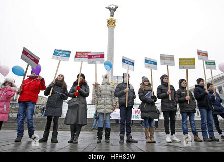 Kiev, Ukraine. 1st Jan, 2017. Ukrainians hold posters with the names of countries with war conflicts, as they attend ''Peace march'' at Independence Square in Kiev, Ukraine, on 01 December 2017. The march dedicated to World Day of Peace, during which believers call to stop all wars and bestow peace on Earth. © Serg Glovny/ZUMA Wire/Alamy Live News Stock Photo