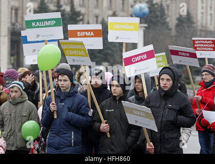 Kiev, Ukraine. 1st Jan, 2017. Ukrainians hold posters with the names of countries, as they attend ''Peace march'' at Independence Square in Kiev, Ukraine, on 01 December 2017. The march dedicated to World Day of Peace, during which believers call to stop all wars and bestow peace on Earth. © Serg Glovny/ZUMA Wire/Alamy Live News Stock Photo