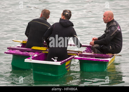 Poole, Dorset, UK. 1st Jan, 2017. Hundreds turn out to watch the New Years Day Bath Tub Race. A variety of unusual craft take to the water to race, having fun throwing eggs and flour, firing water cannons and capsizing competing craft. Three men  in a tub! © Carolyn Jenkins/Alamy Live News Stock Photo