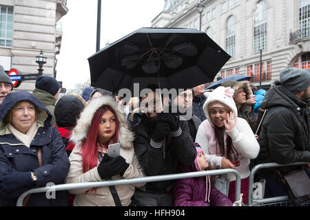 London, UK. 1st Jan, 2017. Torrential down pours of rain at the London New Year's Day Parade didn't dampen spirits as huge crowds still enjoyed the parade Credit: Keith Larby/Alamy Live News Stock Photo