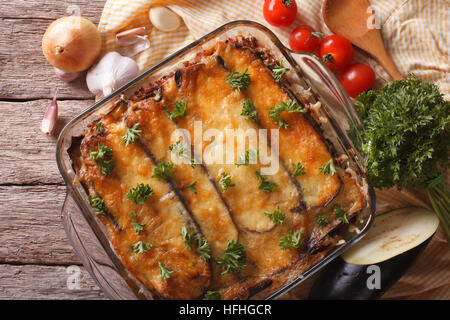 Greek moussaka close up in baking dish with the ingredients on the table. horizontal view from above Stock Photo