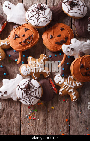 Funny delicious ginger biscuits for Halloween close-up on the table. vertical top view Stock Photo