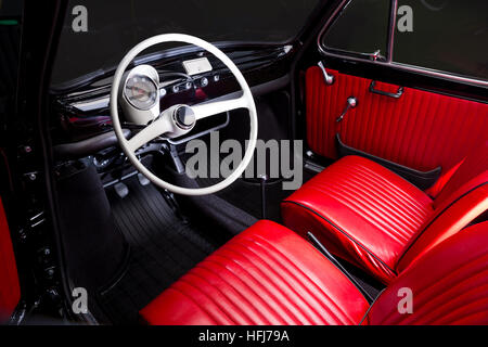 Classic old car interior - red leather Stock Photo