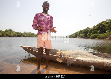 Baro village, Guinea, 1st May 2015: Fishermen prepare their nets. This time is normally good for fishing because the river level is low. Stock Photo