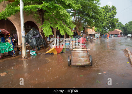 Kankan town, Guinea, 1st May 2015: street scenes while early seasonal rains fall in the town. Stock Photo