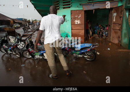 Kankan town, Guinea, 1st May 2015: street scenes while early seasonal rains fall in the town. Stock Photo