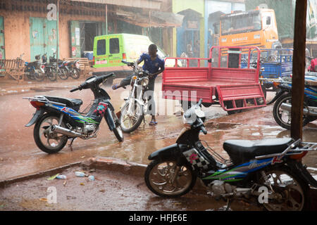 Kankan town, Guinea, 1st May 2015: street scenes while early seasonal rains fall in the town. Stock Photo