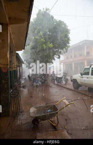 Kankan town, Guinea, 1st May 2015: street scenes while early seasonal rains fall in the town. Stock Photo