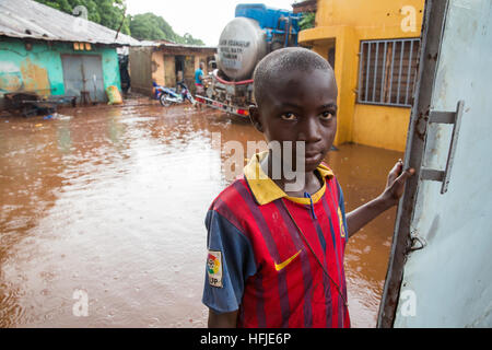 Kankan town, Guinea, 1st May 2015: street scenes while early seasonal rains fall in the town. Stock Photo