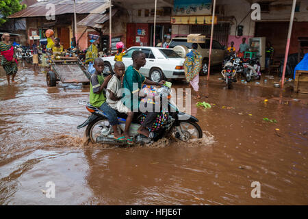 Kankan town, Guinea, 1st May 2015: street scenes while early seasonal rains fall in the town. Stock Photo