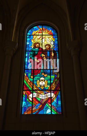 Stained glass window in Cathedral De La Almudena in Madrid Stock Photo