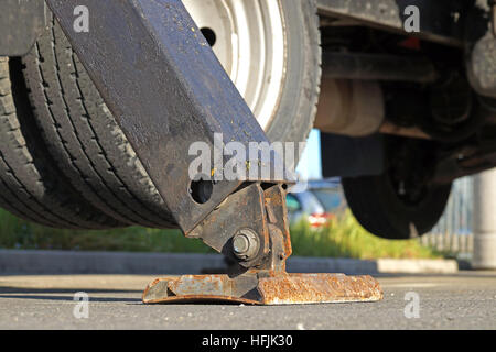 Extended side hydraulic outrigger to increase crane stability until is under heavy duty Stock Photo