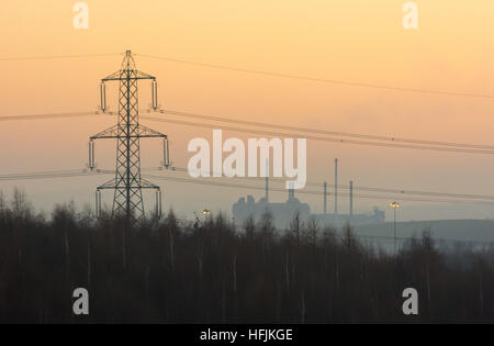 Looking towards the chimneys of the Ardagh Group glass facility at Monk Bretton, Barnsley, South Yorkshire, UK from Royston. Stock Photo