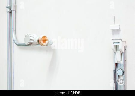 on the wall are the heating pipes already installed without radiator Stock Photo