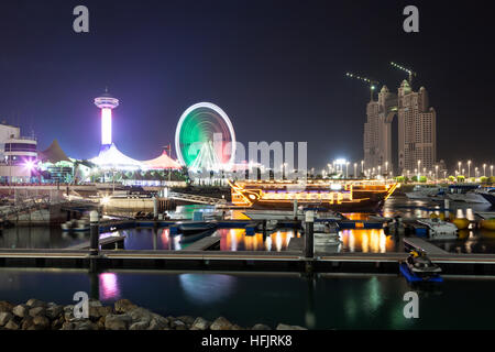 Abu Dhabi Marina illuminated at night Stock Photo