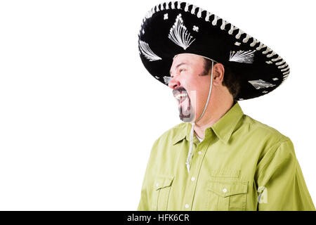 Side view of laughing middle aged man in Mexican sombrero hat on white with copy space Stock Photo