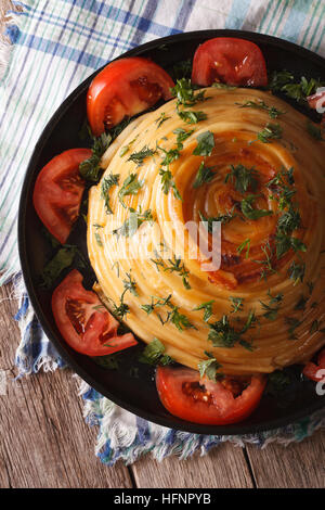 Baked pasta with cheese close-up on a plate. vertical top view Stock Photo