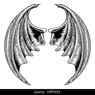 A circular bat demon dragon wings horror Halloween design in a vintage woodcut style Stock Photo