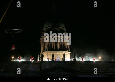 The Fidget Feet acrobatic group perform aerial contemporary dance against Dublin's Custom House as part of the city's New Year's eve celebrations. Stock Photo