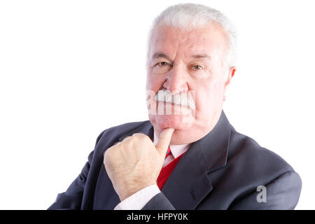 Portrait of elderly businessman in suit resting chin on hand with thoughtful expression, white background Stock Photo