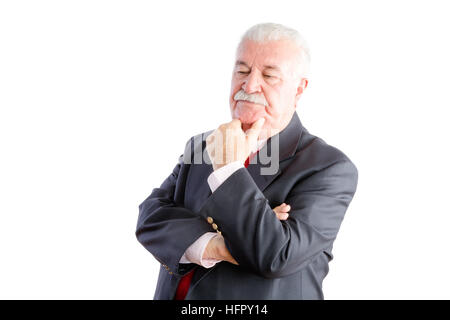 Half body portrait of thoughtful mature businessman in suit with hand on chin, white background Stock Photo
