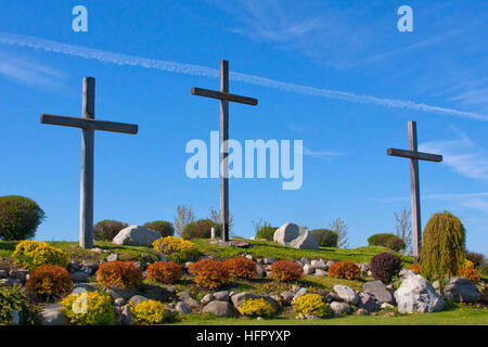 Three crosses against a bright blue sky Stock Photo