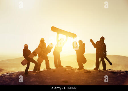 Group team friends ski snowboard skiers Stock Photo